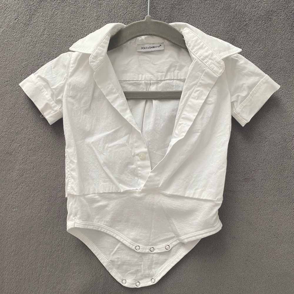 Authentic Dolce and Gabba white cotton baby bodysuit.
